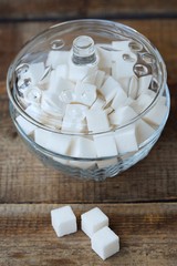 White refined sugar cubes in a glass bowl 