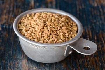 Fenugreek in a Measuring Cup
