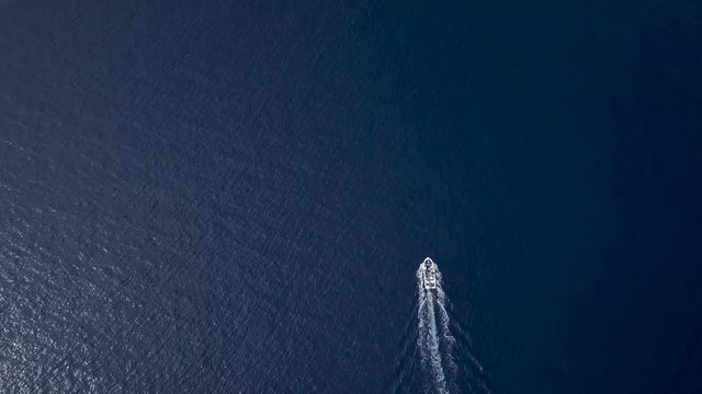 Aerial view of a motor boat sailing the sea fast