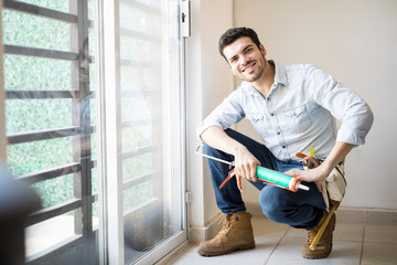 Happy handyman enjoying his job