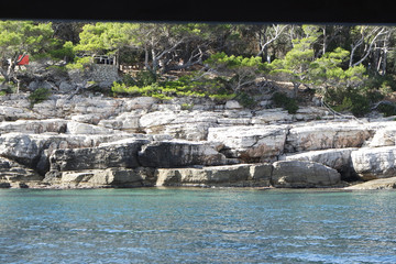wild coast of croatian town dubrovnik from a boat