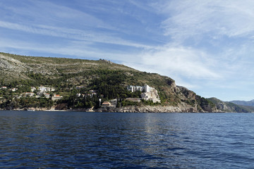 wild coast of croatian town dubrovnik from a boat