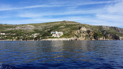 Fototapeta premium wild coast of croatian town dubrovnik from a boat