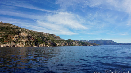 wild coast of croatian town dubrovnik from a boat