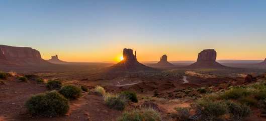 Sunrise at Monument Valley, Panorama of the Mitten Buttes - seen from the visitor center at the Navajo Tribal Park - Arizona and Utah, USA