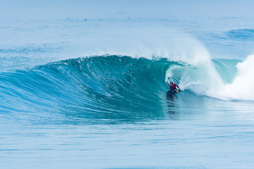 Bodyboarder surfing ocean wave