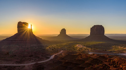 Fototapeta na wymiar Sunrise at Monument Valley, Panorama of the Mitten Buttes - seen from the visitor center at the Navajo Tribal Park - Arizona and Utah, USA