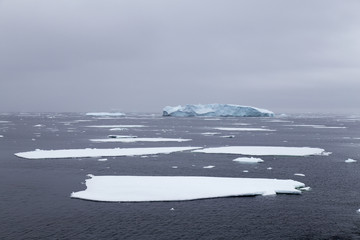 Iceberg amonst sea ice, Antarctica