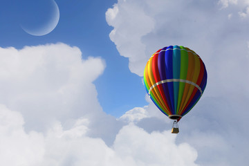 Aerostat floating in day sky. Mixed media