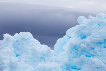 Blue ice with a dark grey background