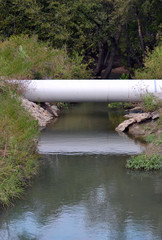 A pipeline crosses a stream