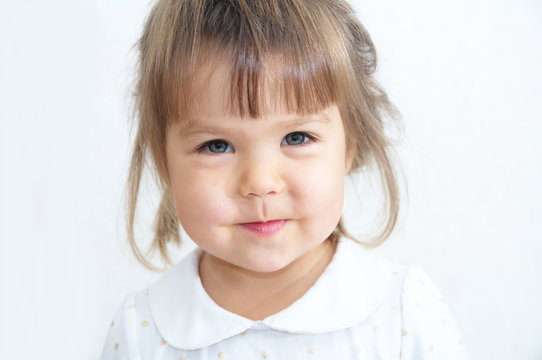 Happy little girl portrait on white background, Caucasyan child