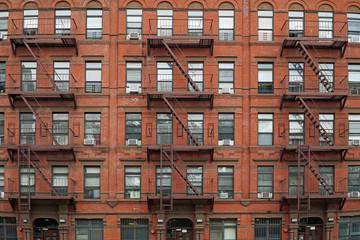 New York City,  old,apartment building with external fire escape - obrazy, fototapety, plakaty