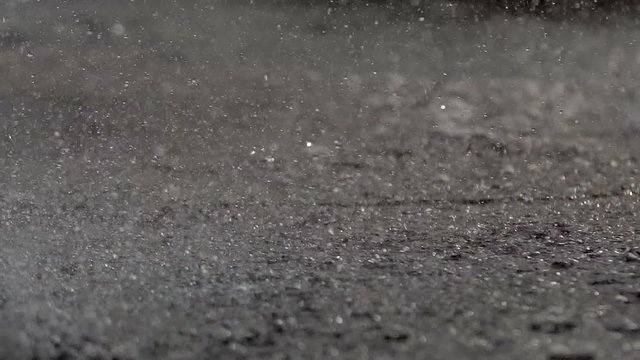 Fountain Rain Drops. Slow movement of the surface of the water splashes a river or pond. Heavy rain or working fountain. Drops of water fall down the macromolecule