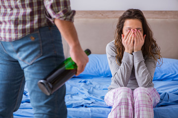 Domestic violence concept in a family argument with drunk alcoho