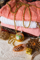 Christmas toys and a stack of knitted sweaters