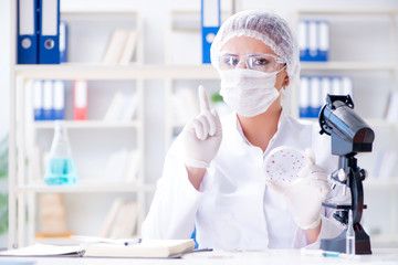 Female scientist researcher conducting an experiment in a labora