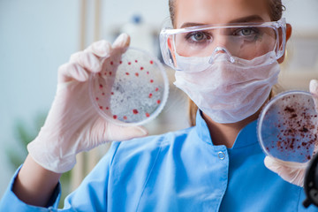 Female scientist researcher conducting an experiment in a labora