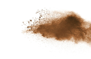 abstract brown powder splatted on white background,Freeze motion of color powder exploding