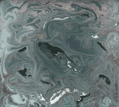 Liquid gold marbled pattern. Pale green background.