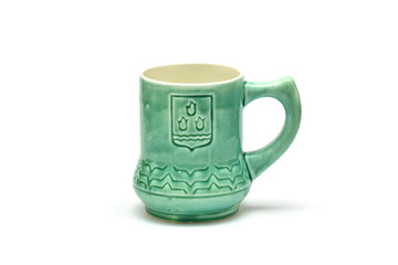 Ceramic cup with the emblem of Baku city on white background