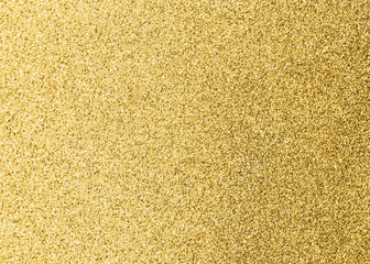 Gold glitter texture background of brilliant yellow metallic golden Christmas holiday decoration backdrop design element