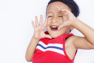 Cute asian child positive and real smile over white background
