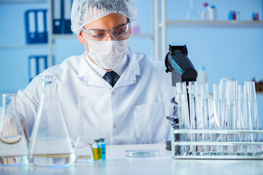 Female scientist researcher conducting an experiment in a labora