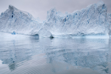 Fototapeta na wymiar A huge iceberg has calved from a glacier. Showing beautiful blue ice