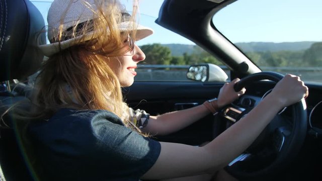 Attractive Woman Driver In Convertible Car