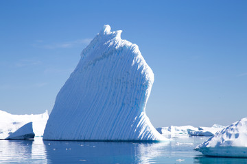 An iceberg has melted in to fantastic shapes