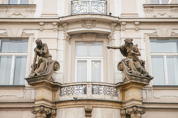 Fototapeta na wymiar Antique style sculpture on the facade of building