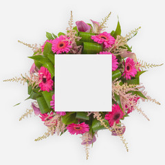 Creative layout with colorful flowers, leaves and copy space card note. Flat lay.