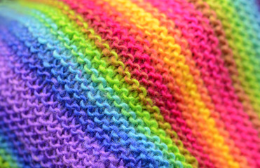 Rainbow knitting or knitted fabric texture pattern background. Knitting pattern for design.