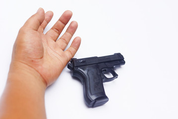 The Hand Of The Dead With Handgun Over White Background