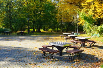 table to play chess in autumn park - golden autumn