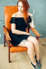 Portrait of bizarre red hair Gothic Girl. studio shot