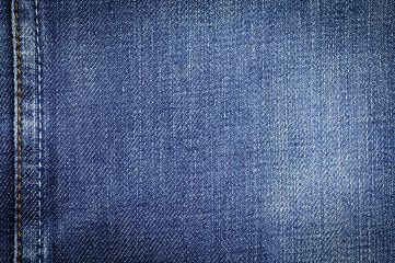 Naklejka premium Denim jeans fabric texture or denim jeans background with seam for beauty clothing. fashion business design and industrial construction idea concept.