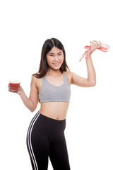 Healthy Asian girl diet with tomato juice and measuring tape on diet.