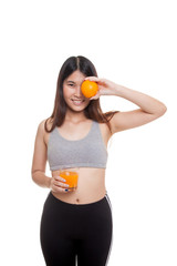 Beautiful Asian healthy girl with orange juice and orange fruit.