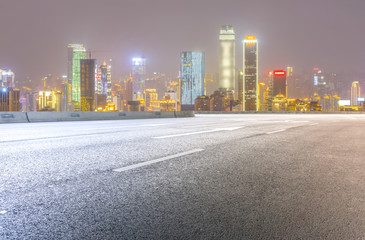 Fototapeta premium Road pavement and city skyline