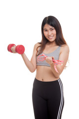 Beautiful Asian healthy girl with dumbbell and measuring tape.