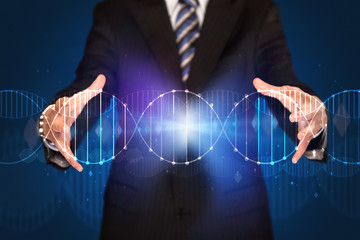 Businessman holding DNA