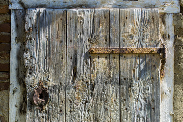 Texture of aged wooden door on old house