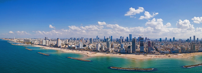 Tel Aviv skyline off the shore of the Mediterranean sea - Panoramic aerial image - obrazy, fototapety, plakaty