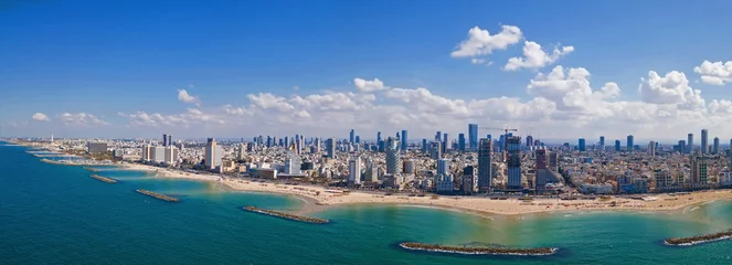 Fotobehang Tel Aviv skyline off the shore of the Mediterranean sea - Panoramic aerial image © STOCKSTUDIO