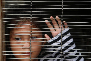 Asian girl children in the cage