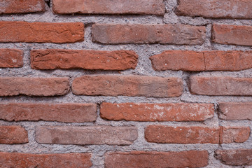 Vintage red brick wall. Grunge background  to interior design.