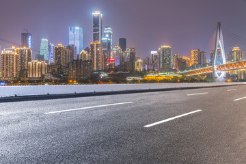 Road pavement and city skyline