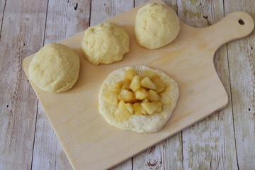 Apple filling and dough ready to make apple pies